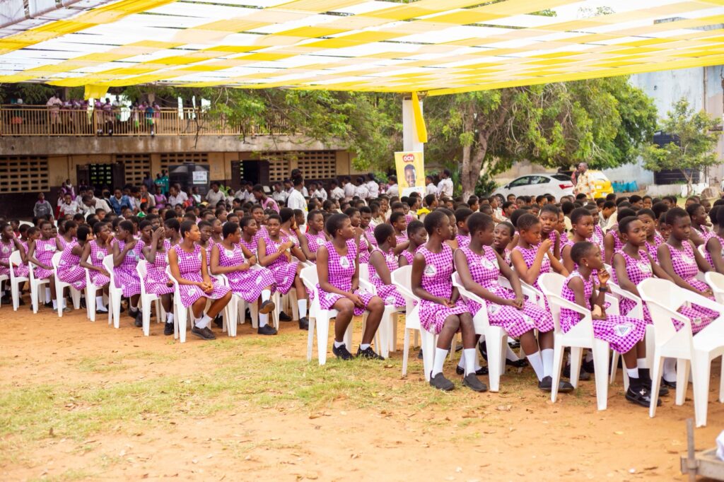 Hundreds of schoolgirls seated at the Smile Culture Foundation hygiene outreach in Accra