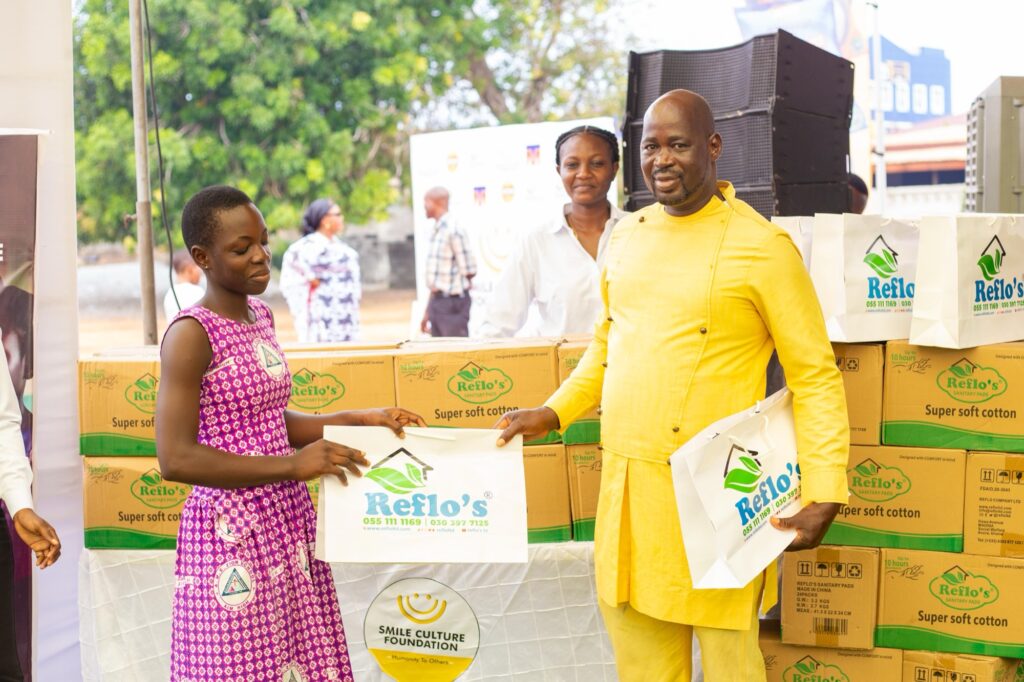 Distributing sanitary pad packs to primary school girls in Accra